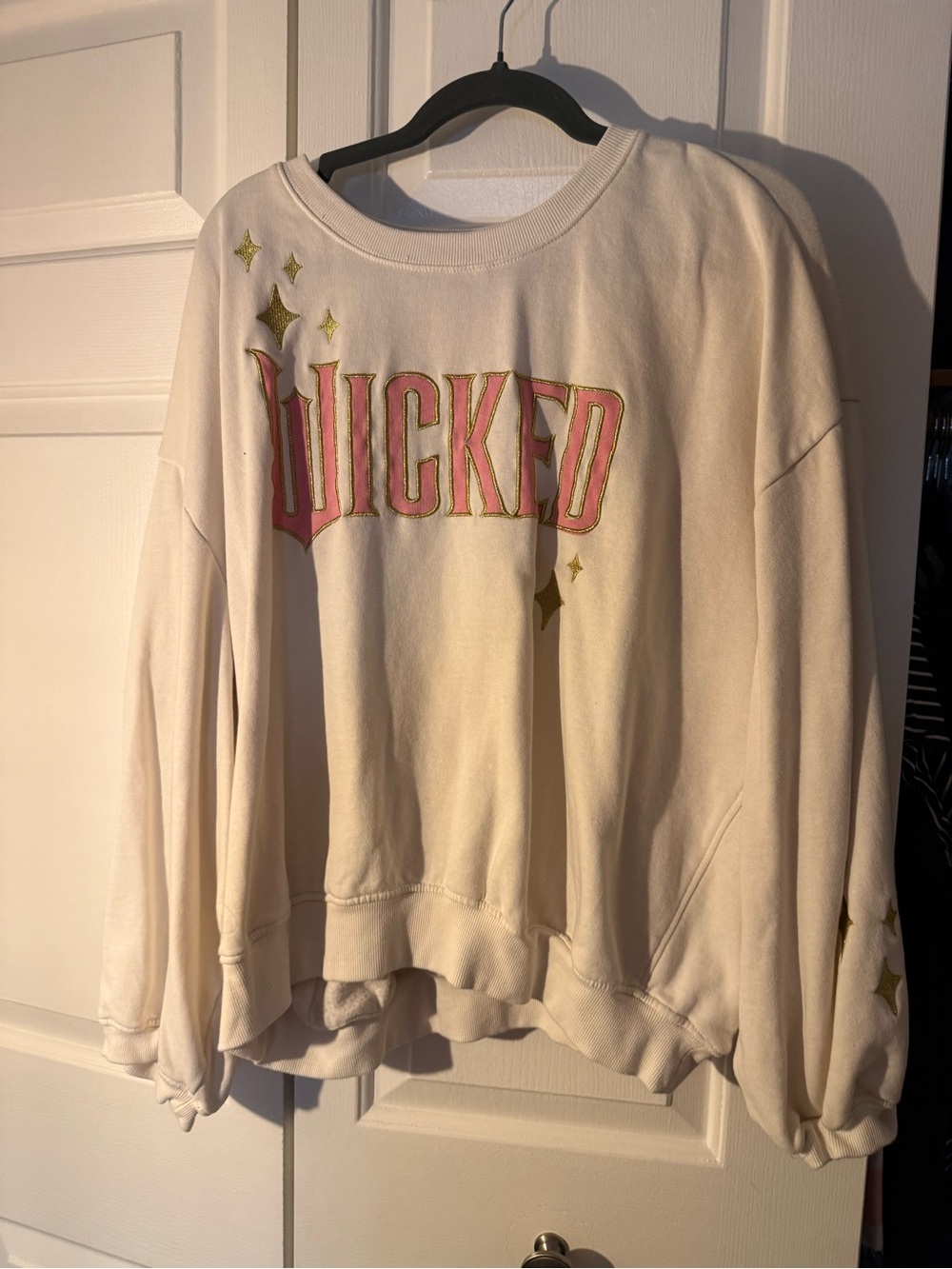 Cream Crewneck Sweatshirt with Pink 'WICKED' and Gold Stars